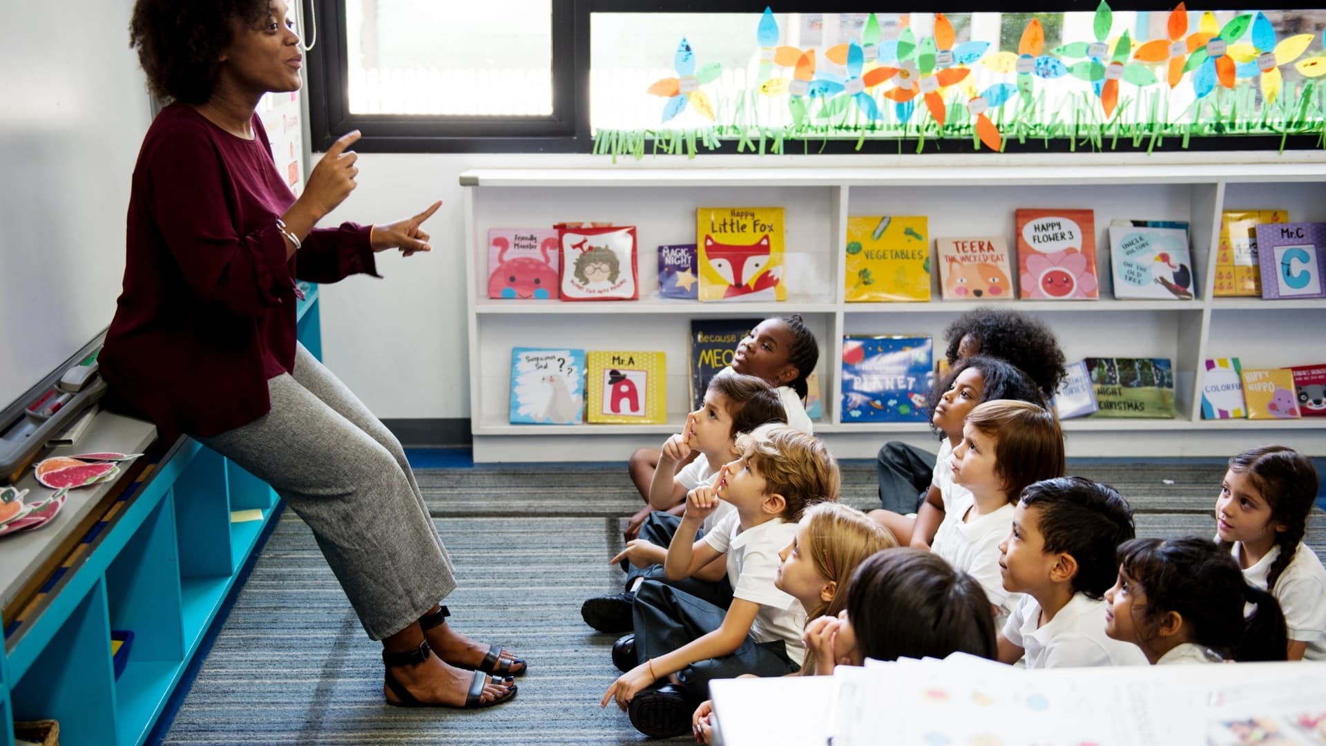 Woman instructing classroom